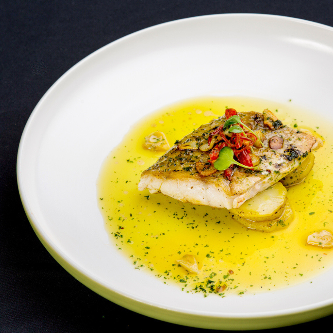 Pescado en salsa de vino y limón